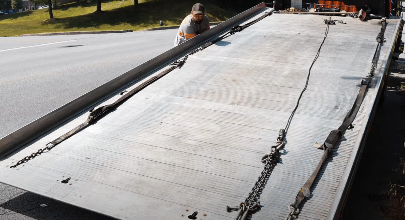 Flatbed Towing Service - Professional vehicle transport by Beavercreek Towing Professional flatbed tow truck with extended loading deck for secure vehicle transport